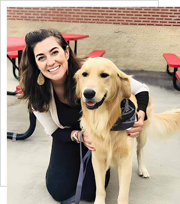 A woman and her dog pose for the camera.