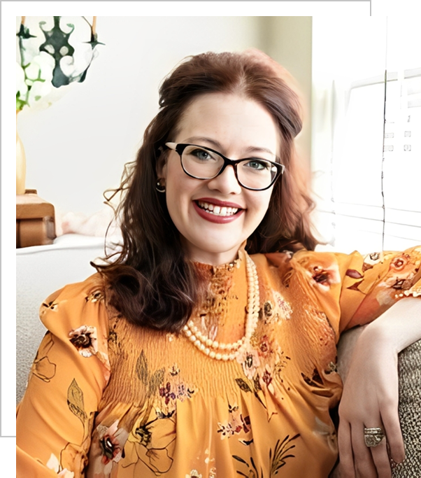 A woman in glasses and an orange dress